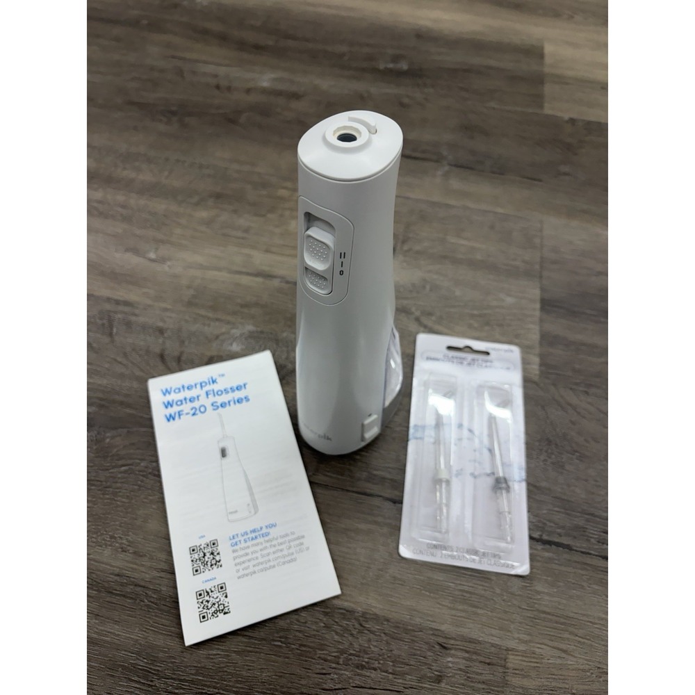 Waterpik Cordless Pulse 3100 Rechargeable Portable Water Flosser With 2 New Tips